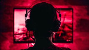 woman playing video games in the dark