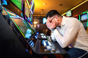 worried man losing at slots