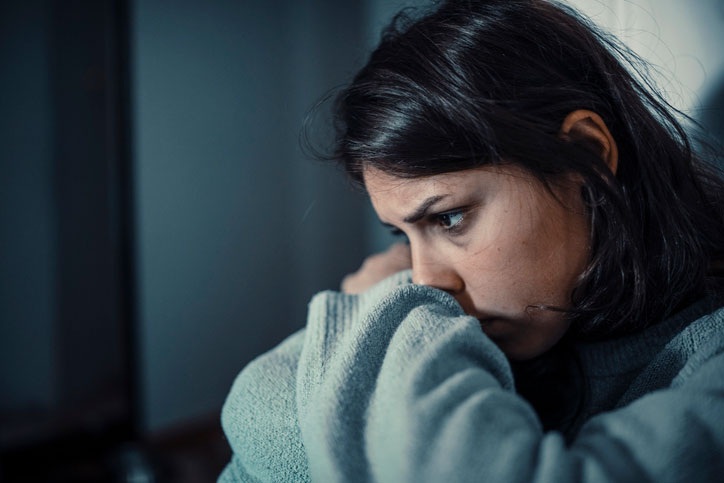 mentally distressed woman alone