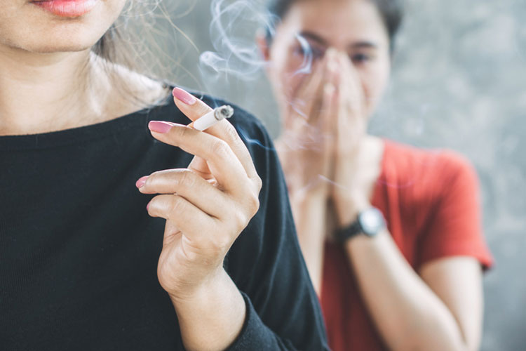 second hand smoke offending woman