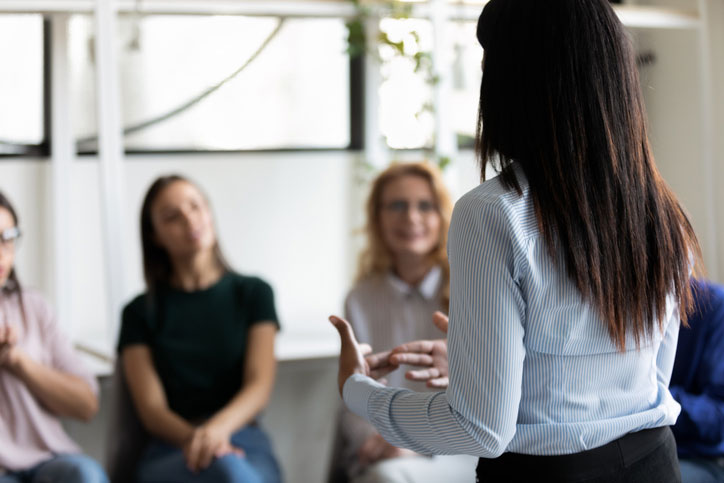 women in group addiction therapy session