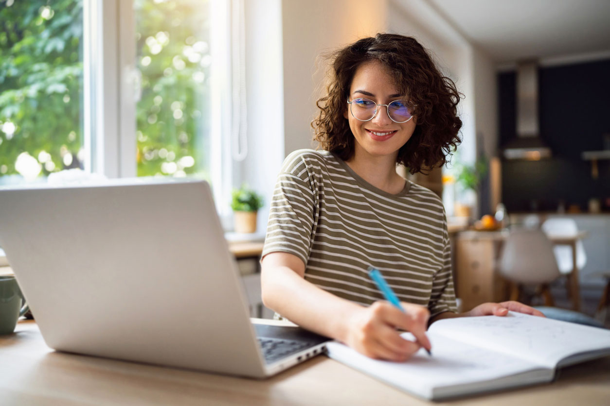 student on computer working from home